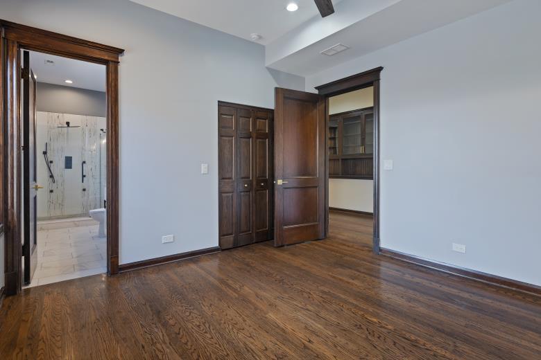 446 East 48th Street, Unit 3E Chicago, IL 60615 - Photo 26 of 33 an empty room with wooden floor and windows