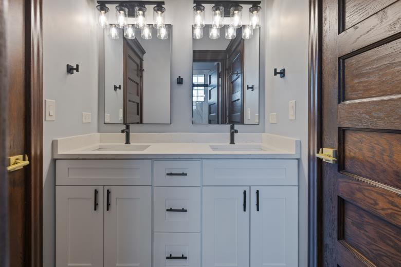 446 East 48th Street, Unit 3E Chicago, IL 60615 - Photo 31 of 33 a bathroom with a double vanity sink and a mirror