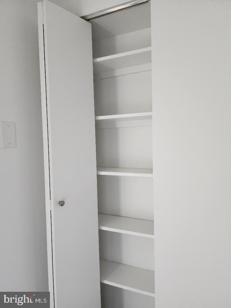 307 Yoakum Parkway, Unit 1024 Alexandria, VA 22304 - Photo 12 of 50 a view of walk in closet with empty racks