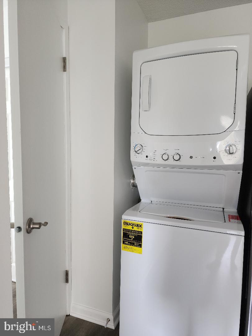 307 Yoakum Parkway, Unit 1024 Alexandria, VA 22304 - Photo 13 of 50 a utility room with dryer and washer