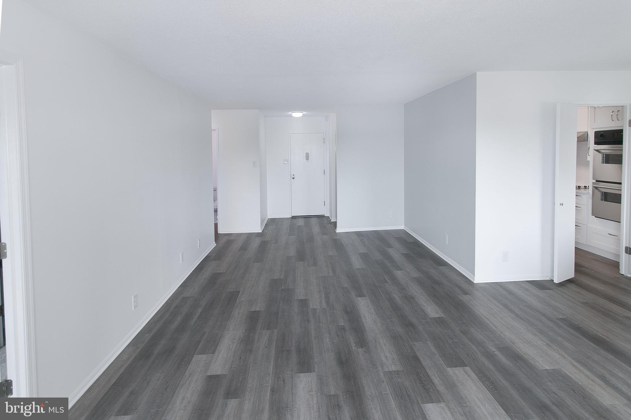 307 Yoakum Parkway, Unit 1024 Alexandria, VA 22304 - Photo 14 of 50 a view of a room with wooden floor