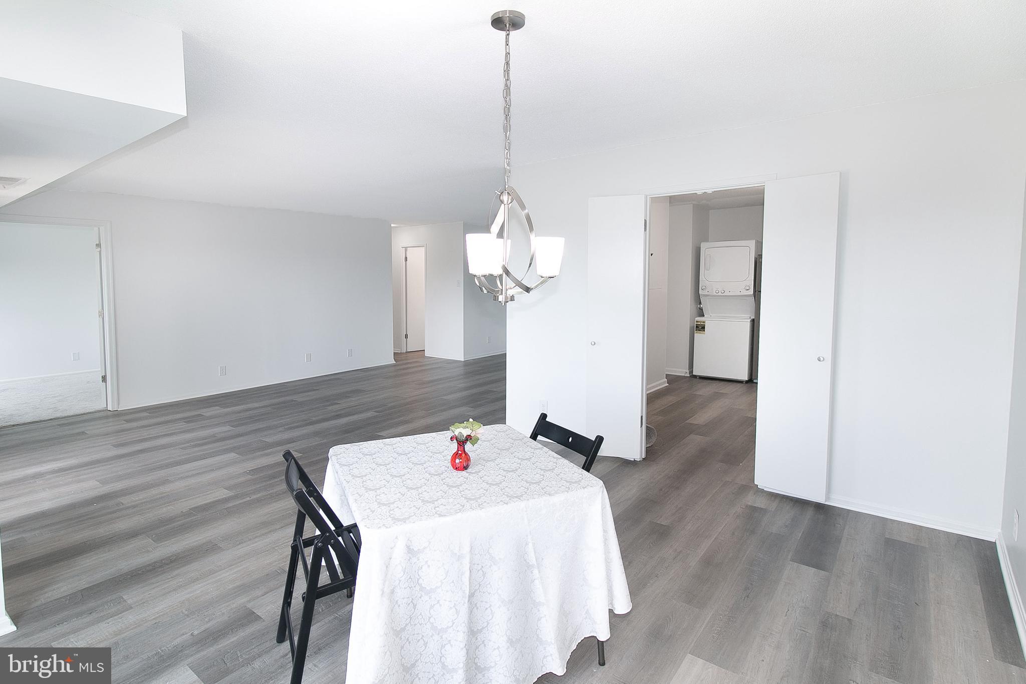 307 Yoakum Parkway, Unit 1024 Alexandria, VA 22304 - Photo 24 of 50 a very nice looking dining room with a table and chairs
