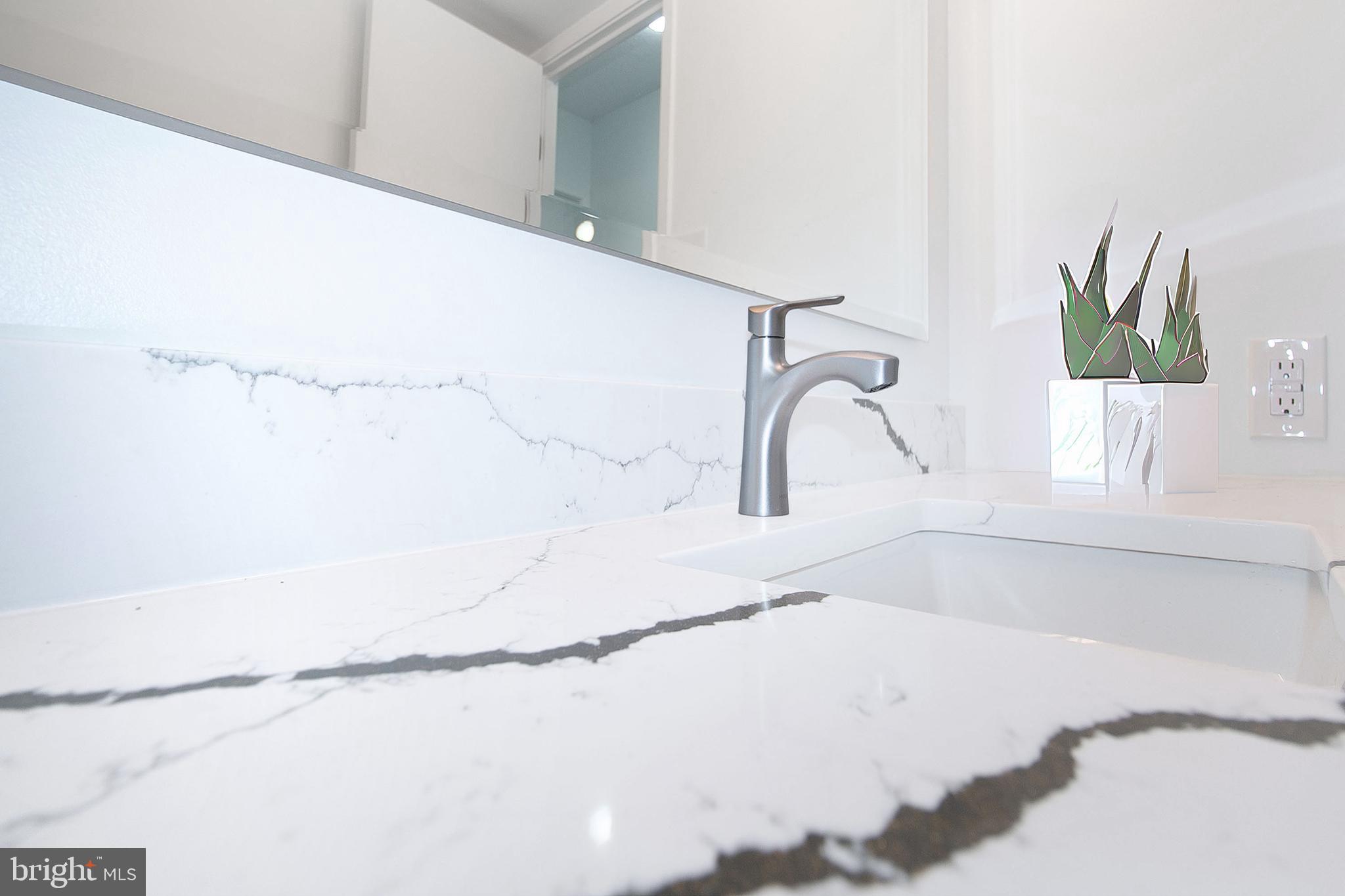 307 Yoakum Parkway, Unit 1024 Alexandria, VA 22304 - Photo 27 of 50 a bathroom with a bathtub and a window