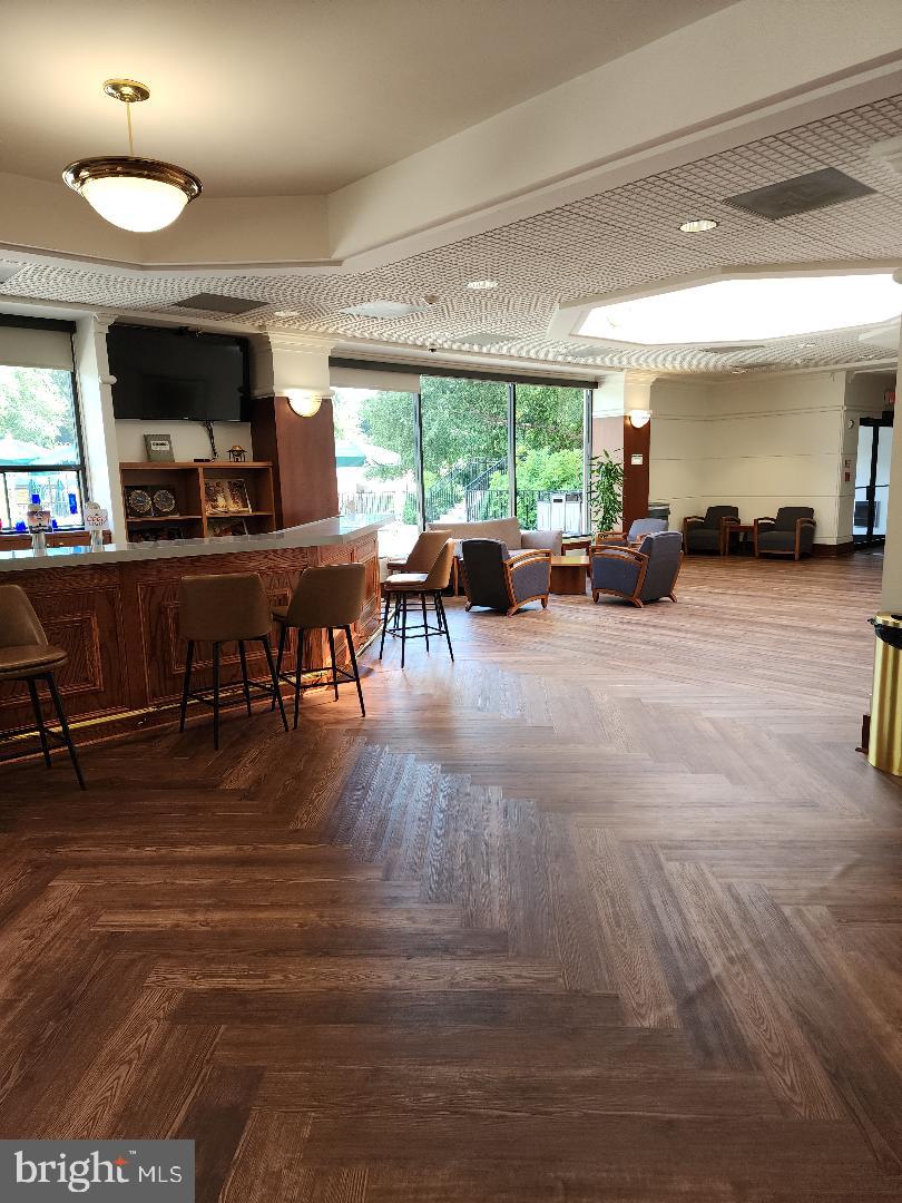 307 Yoakum Parkway, Unit 1024 Alexandria, VA 22304 - Photo 38 of 50 a living room with furniture and a large window