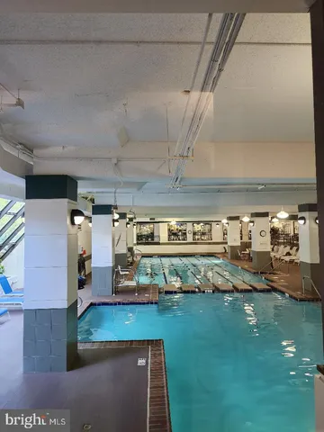 a workspace area with a table and chairs