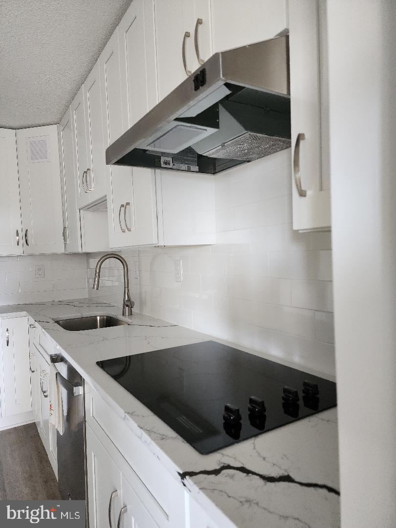 307 Yoakum Parkway, Unit 1024 Alexandria, VA 22304 - Photo 8 of 50 a kitchen with a sink cabinets and stainless steel appliances