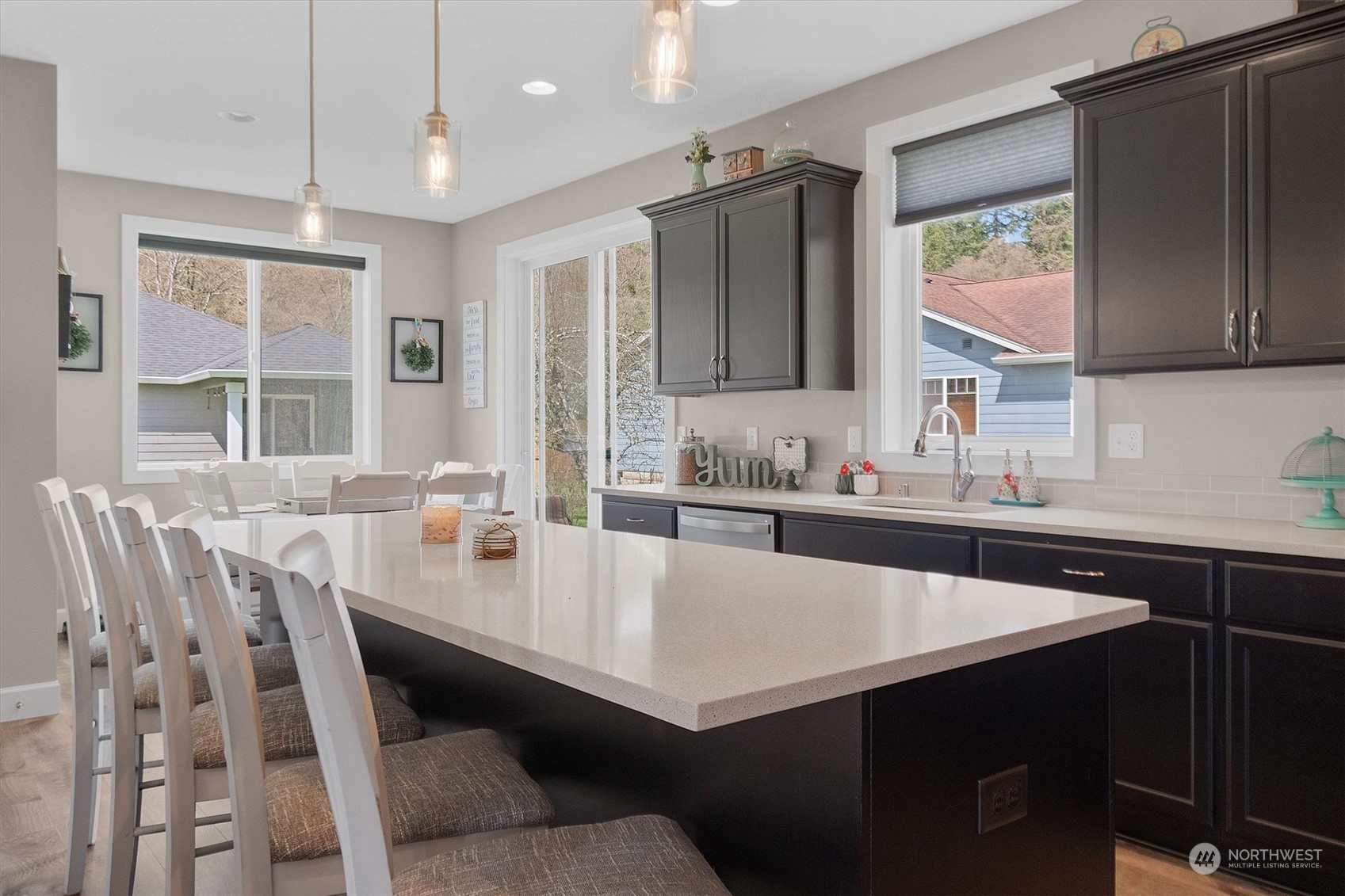 4768 Pacific Way Longview, WA 98632 - Photo 12 of 25 a kitchen with a table chairs sink and cabinets