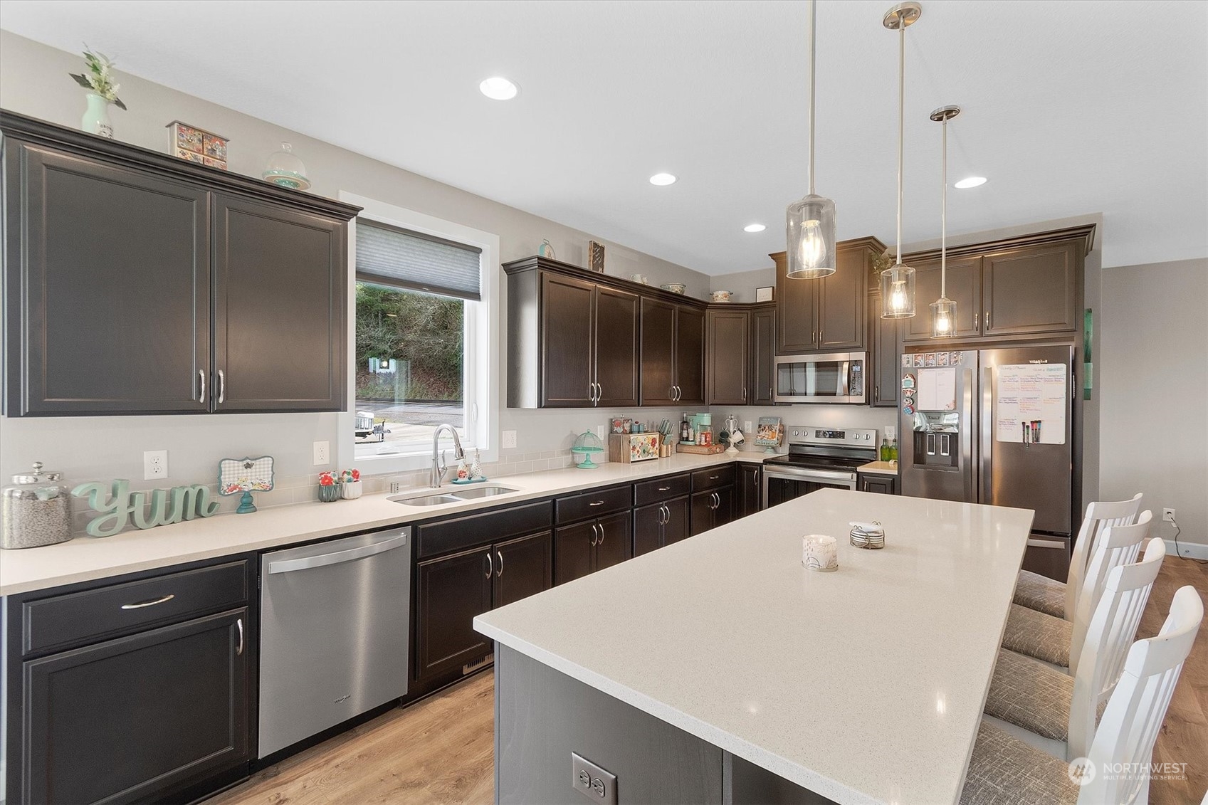 4768 Pacific Way Longview, WA 98632 - Photo 13 of 25 a large kitchen with a sink a counter space appliances and cabinets