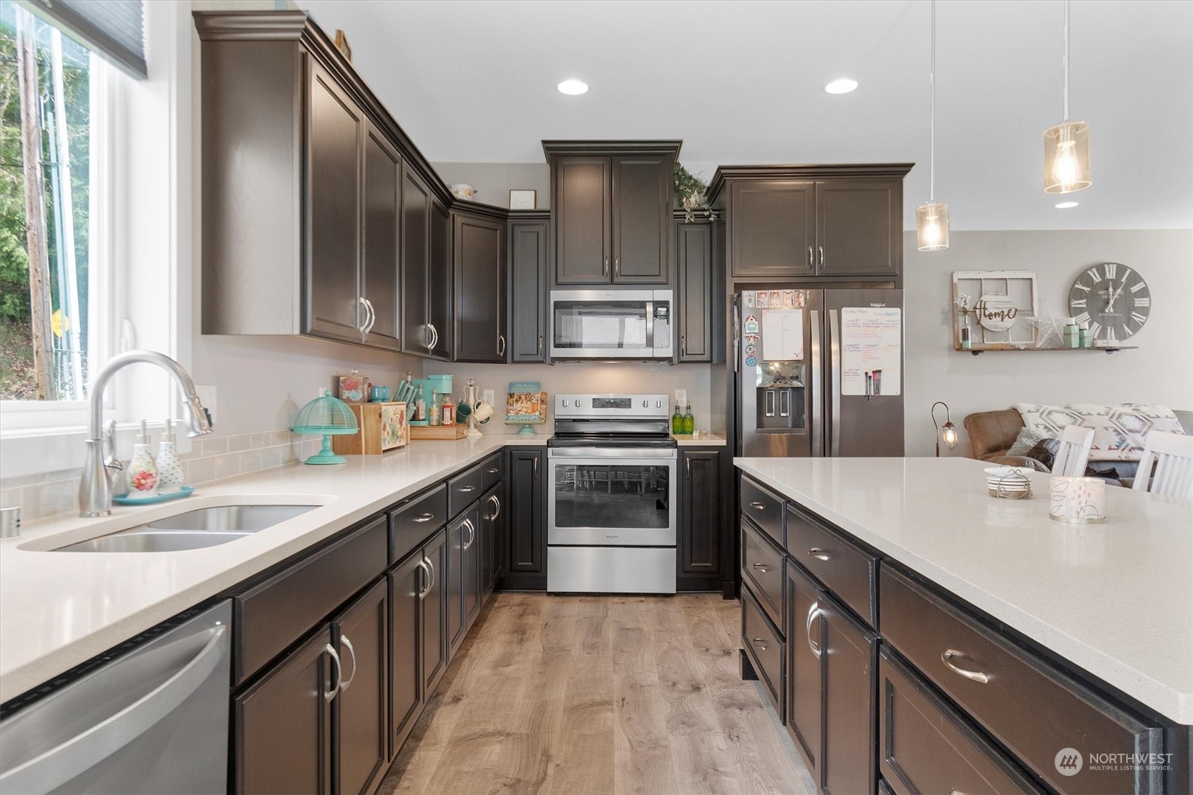 4768 Pacific Way Longview, WA 98632 - Photo 14 of 25 a kitchen with stainless steel appliances granite countertop a sink stove and refrigerator