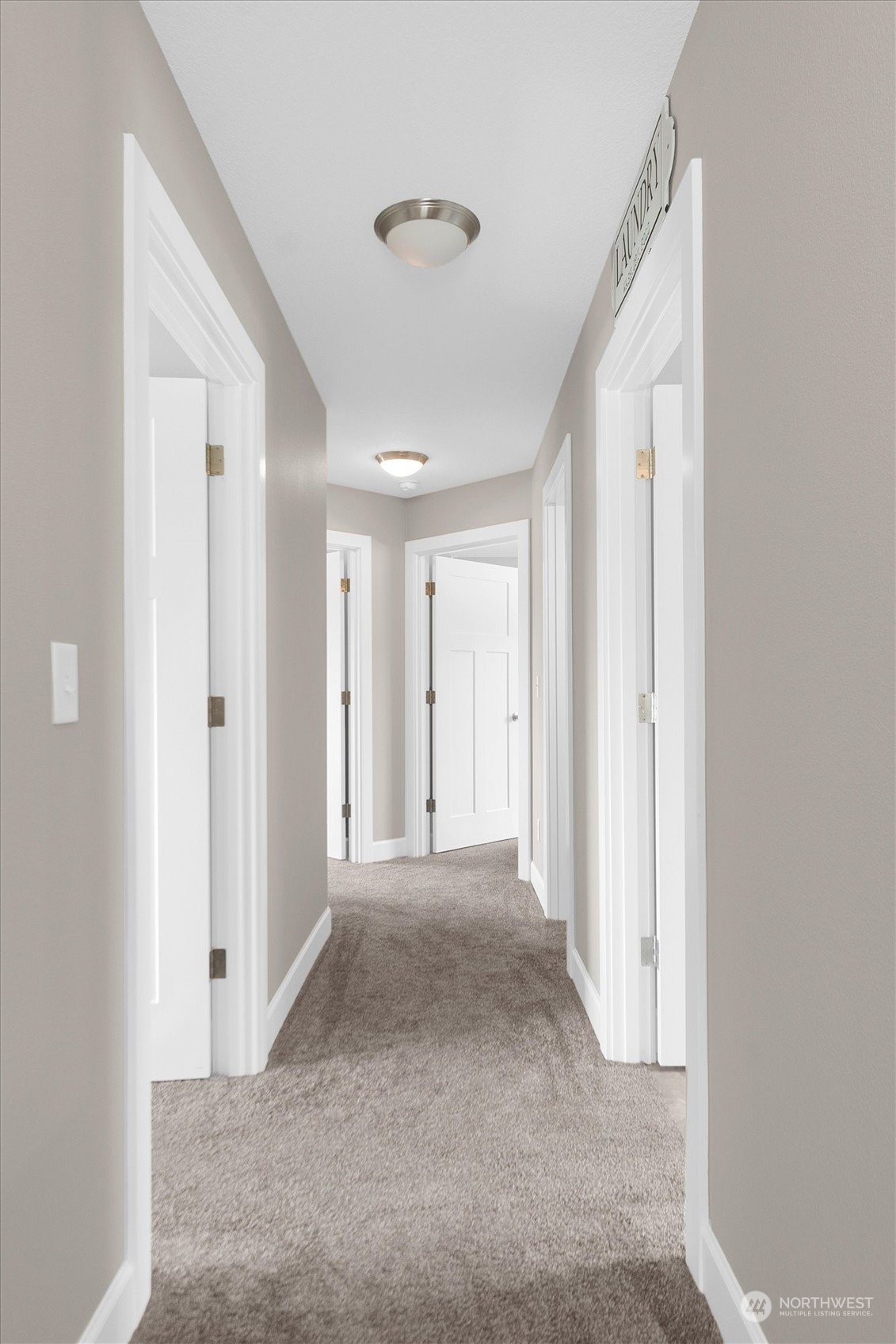 4768 Pacific Way Longview, WA 98632 - Photo 17 of 25 a view of a hallway with wooden shelves