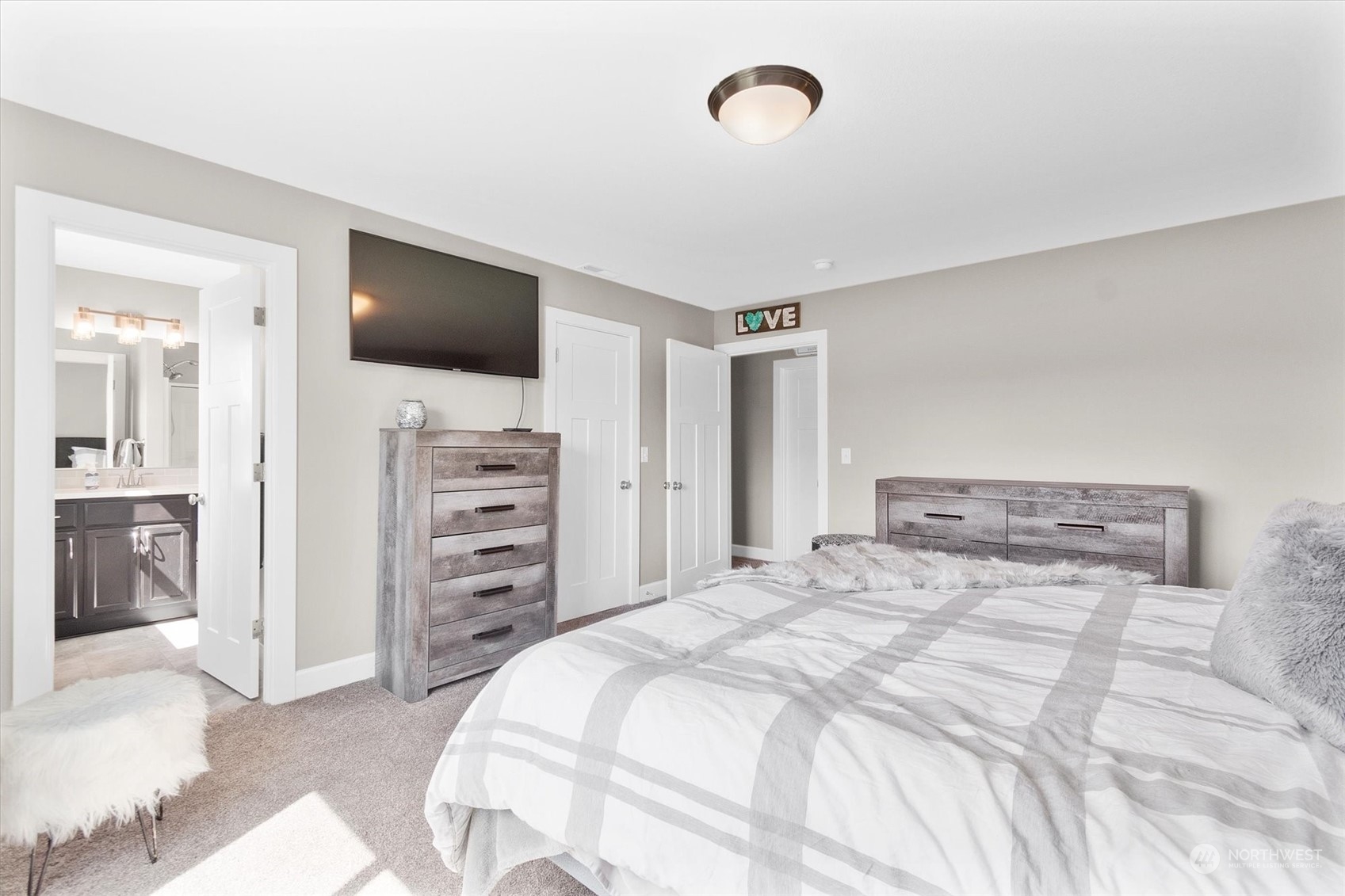 4768 Pacific Way Longview, WA 98632 - Photo 19 of 25 a bedroom with a bed and a flat screen tv