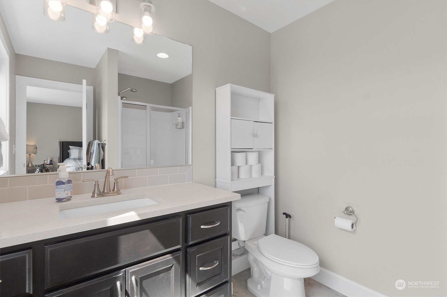 4768 Pacific Way Longview, WA 98632 - Photo 20 of 25 a bathroom with a sink a toilet a shower and a mirror