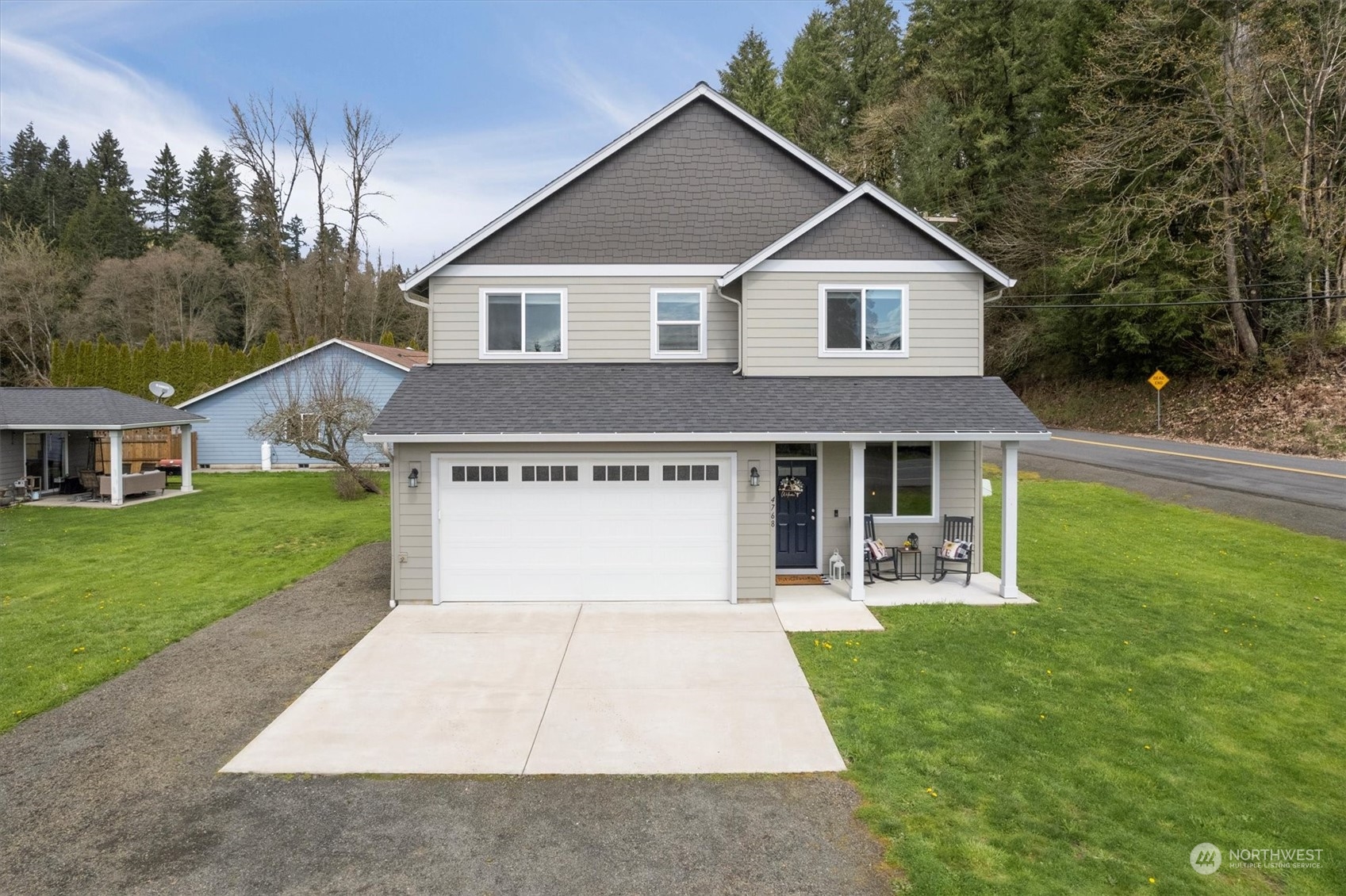 4768 Pacific Way Longview, WA 98632 - Photo 2 of 25 a front view of house with yard and green space