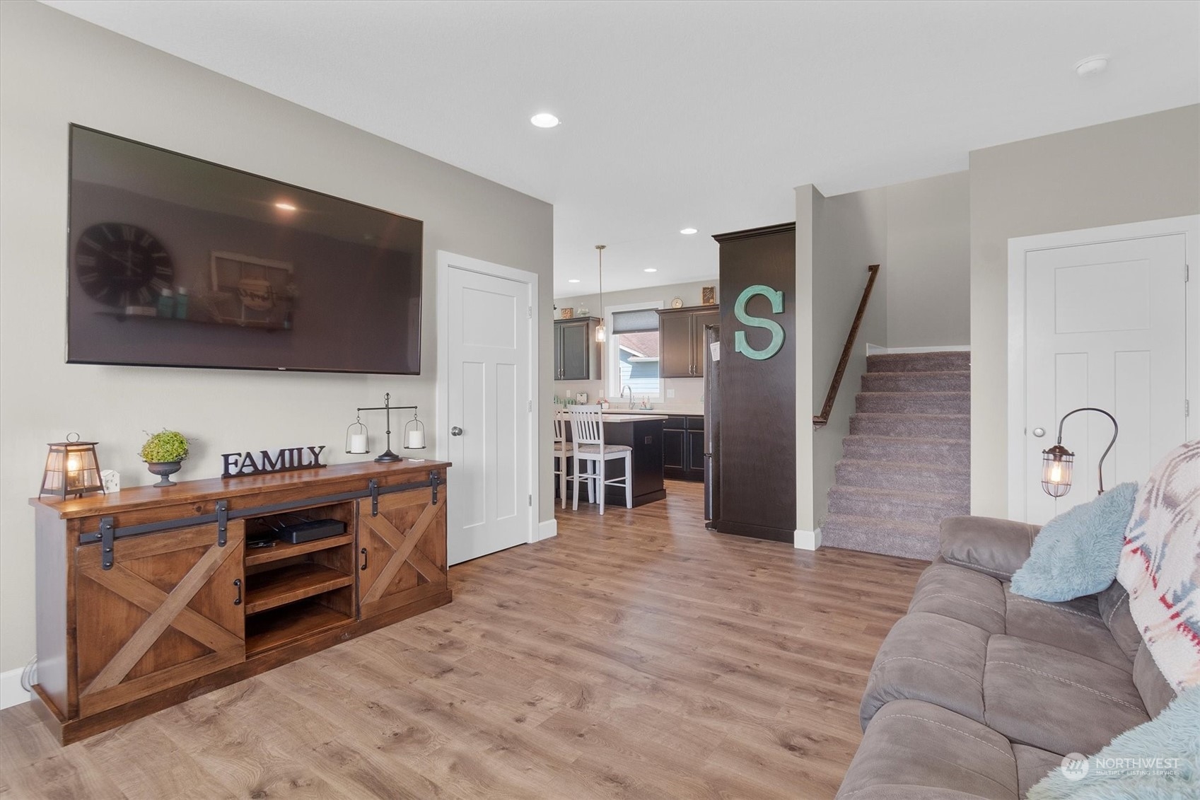 4768 Pacific Way Longview, WA 98632 - Photo 9 of 25 a living room with furniture and a flat screen tv