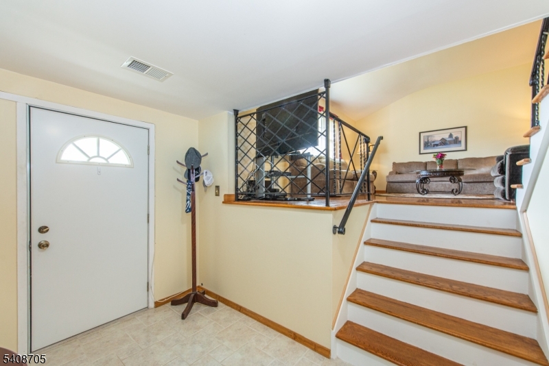 4 George Street Succasunna, NJ 07876 - Photo 19 of 34 a view of a livingroom with wooden floor and stairs