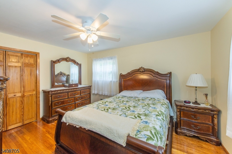 4 George Street Succasunna, NJ 07876 - Photo 20 of 34 a bedroom with a bed and wooden floor
