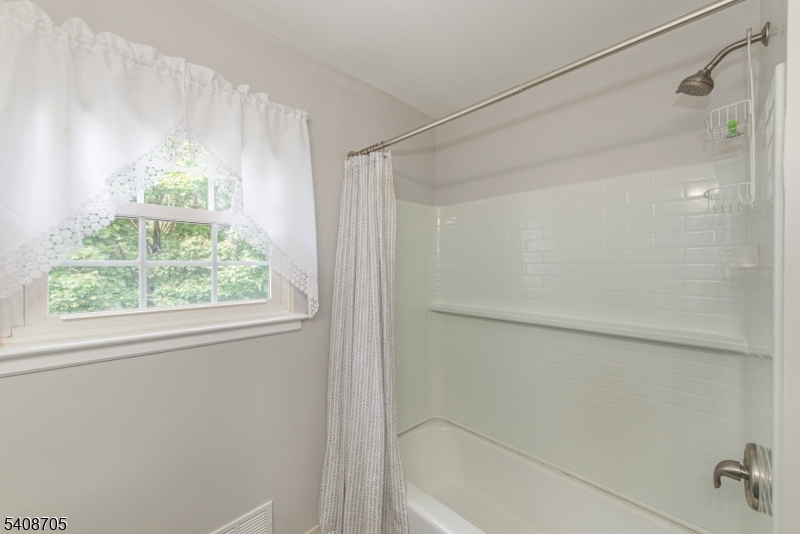 4 George Street Succasunna, NJ 07876 - Photo 25 of 34 a bathroom with a window and a shower