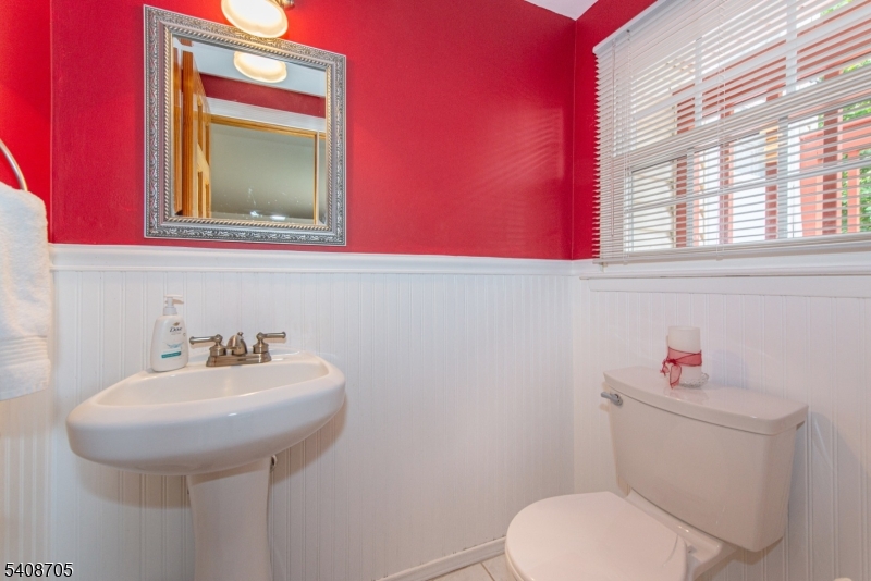 4 George Street Succasunna, NJ 07876 - Photo 26 of 34 a bathroom with a toilet sink and mirror
