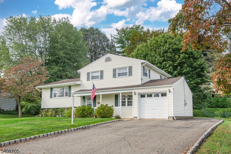 4 George Street Succasunna, NJ 07876 - Photo 34 of 34 a front view of a house with a garden and trees
