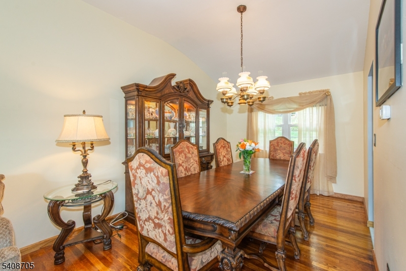 4 George Street Succasunna, NJ 07876 - Photo 10 of 34 a view of a dining room with furniture and chandelier
