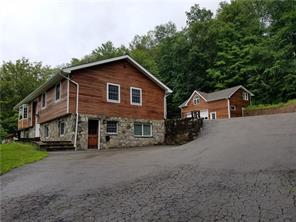 268 Peekskill Hollow Road Putnam Valley, NY 10579 - Photo 1 of 1 Front of Home and two car garage behind home! Side door to apartment..
