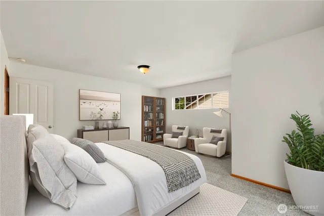 a bedroom with a bed and a potted plant