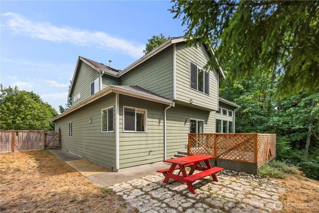 a backyard of a house with small yard and wooden fence