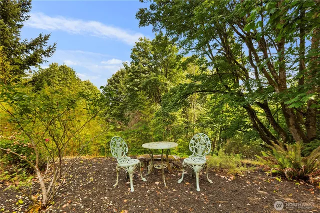 a view of a chairs and table in the patio