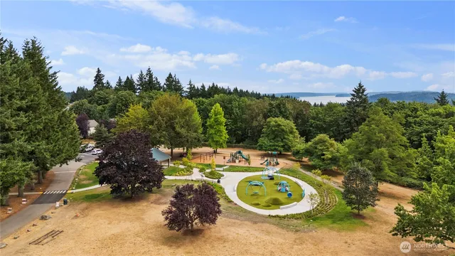 a wooden table with chairs and trees