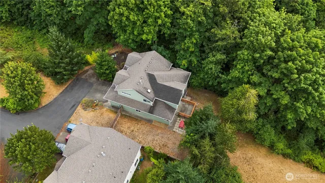 an aerial view of a house with outdoor space and street view