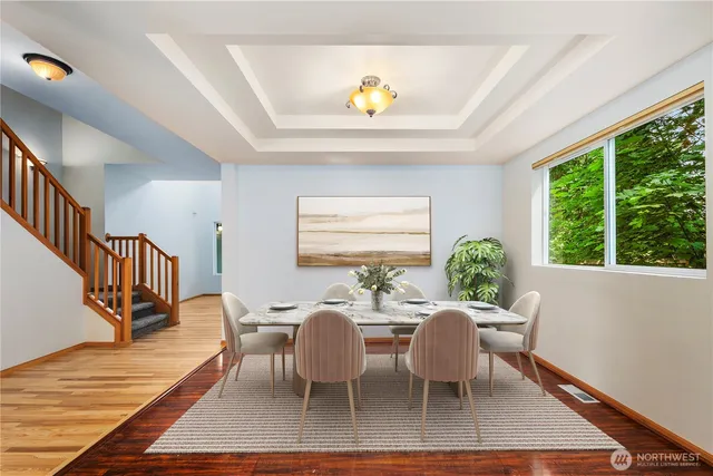 a view of a dining room with furniture window and wooden floor