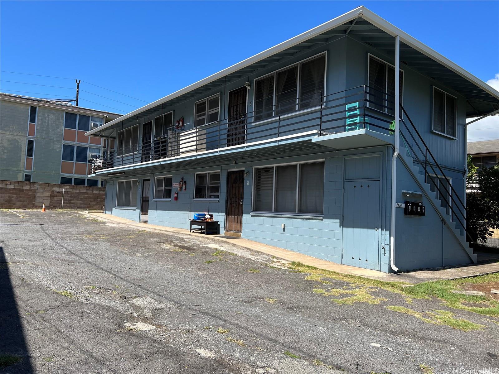2958 Varsity Circle Honolulu, HI 96826 - Photo 1 of 1 a front view of a house with a yard