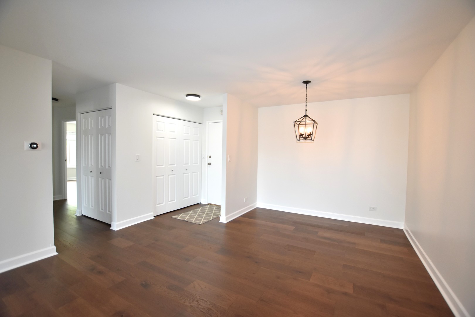 500 West Huntington Commons Road, Unit 157 Mount Prospect, IL 60056 - Photo 9 of 24 a view of a room with wooden floor