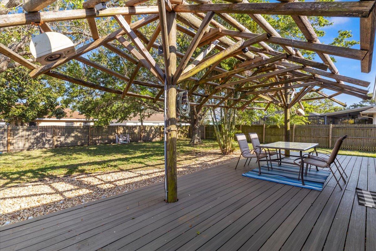 4243 Southwest Utterback Street Port St. Lucie, FL 34953 - Photo 17 of 28 a view of a yard with furniture and wooden floor