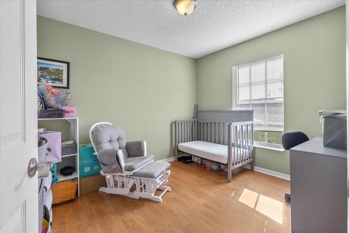 4243 Southwest Utterback Street Port St. Lucie, FL 34953 - Photo 18 of 28 a living room with furniture and a window