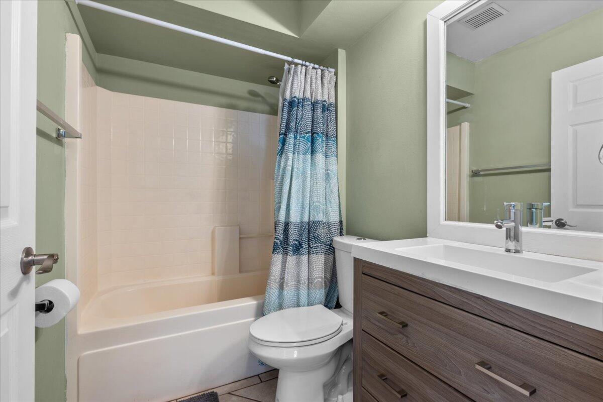 4243 Southwest Utterback Street Port St. Lucie, FL 34953 - Photo 20 of 28 a bathroom with a sink toilet and shower