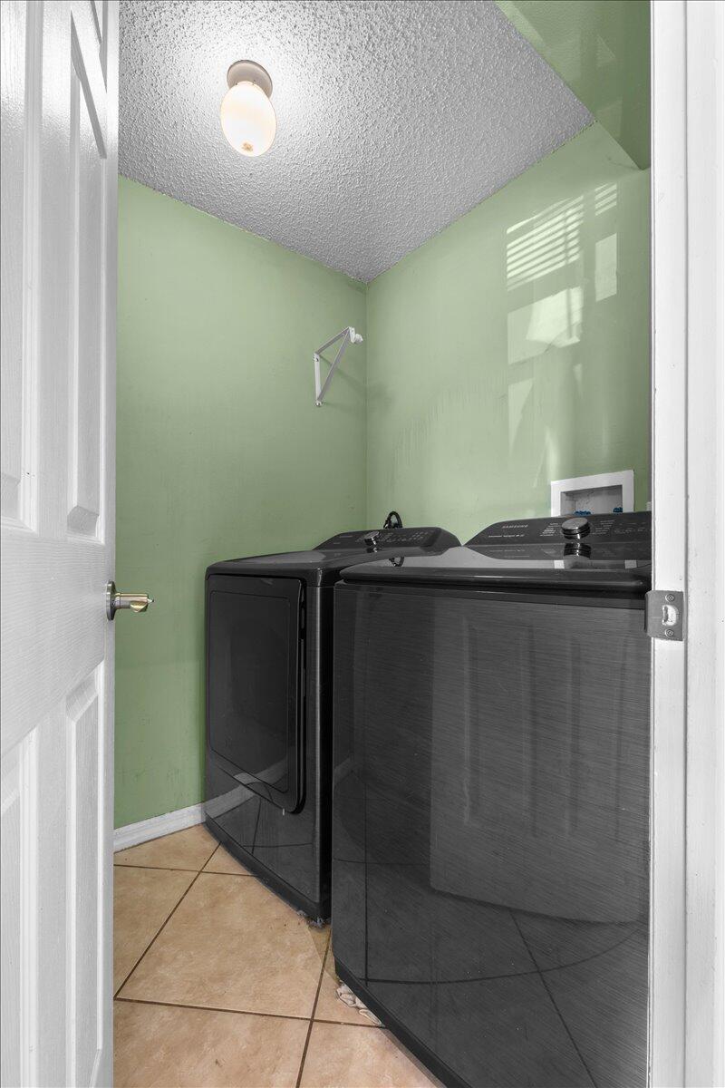 4243 Southwest Utterback Street Port St. Lucie, FL 34953 - Photo 23 of 28 a bathroom with a sink and a mirror