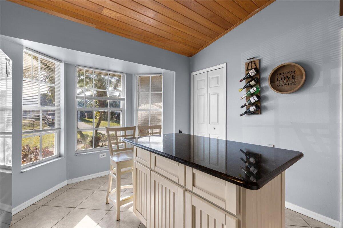 4243 Southwest Utterback Street Port St. Lucie, FL 34953 - Photo 9 of 28 a kitchen with a sink and a stove