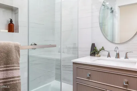 a bathroom with a sink and a mirror