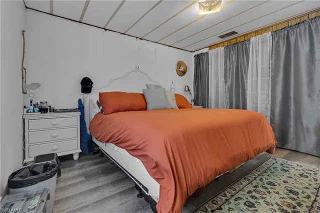 a bedroom with a bed and a closet