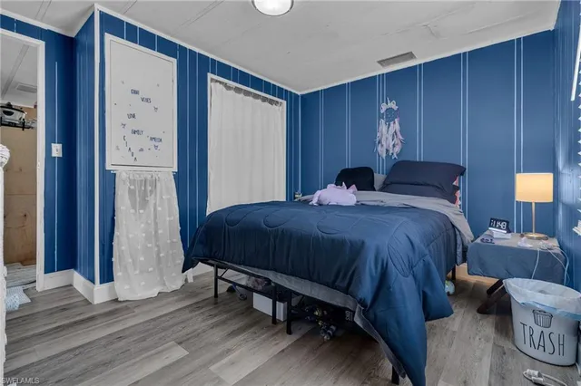 a bedroom with a bed and a table