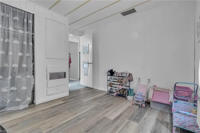 a room with furniture and a wooden floor