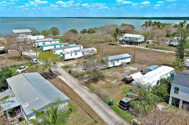 an aerial view of a house with outdoor space