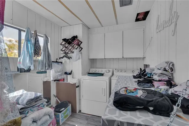 a room with a refrigerator and a window