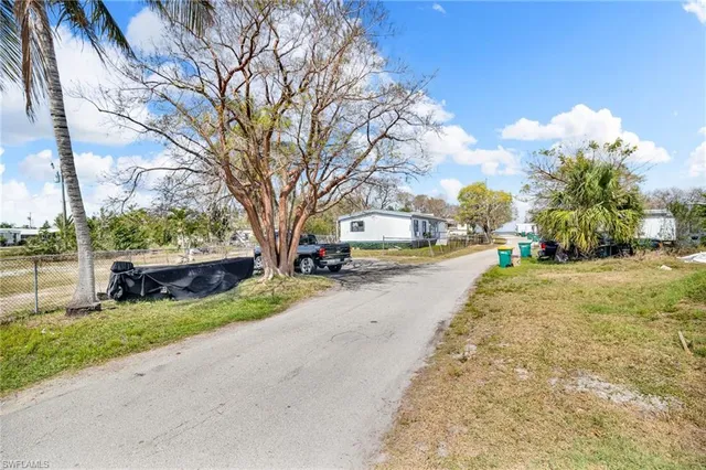 a view of a street with houses on both side