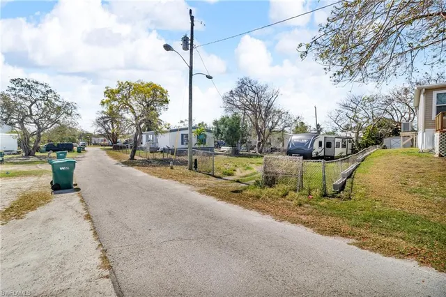 a view of a swimming pool with a yard