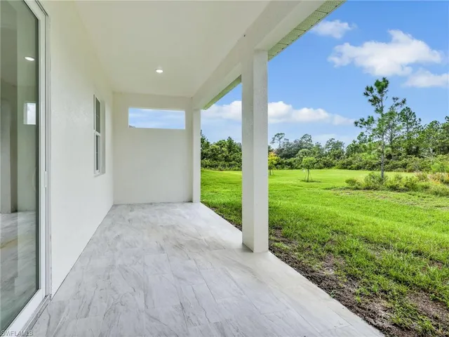 a view of a backyard of the house