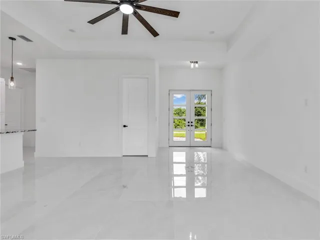 a view of an empty room with a window