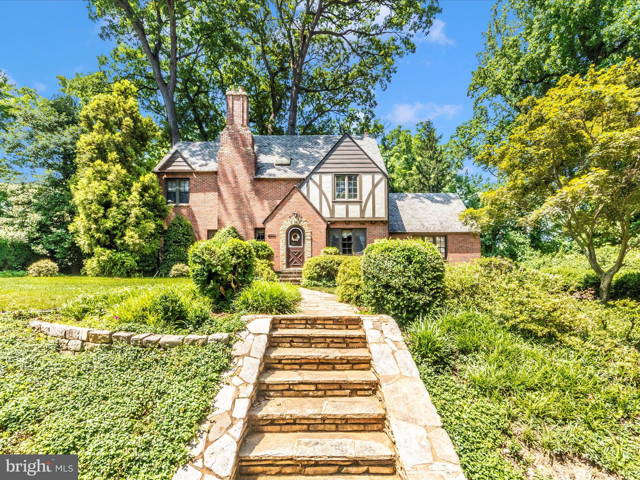5100 Brook Green Road Baltimore, MD 21229 - Photo 1 of 54 a front view of a house with a yard
