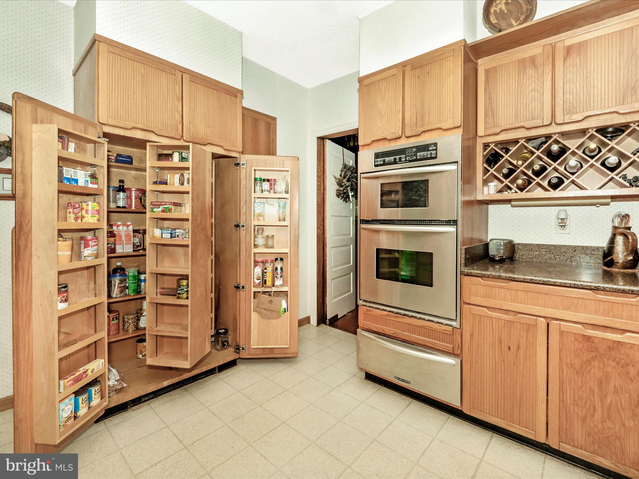 5100 Brook Green Road Baltimore, MD 21229 - Photo 14 of 54 a kitchen with stainless steel appliances and cabinets
